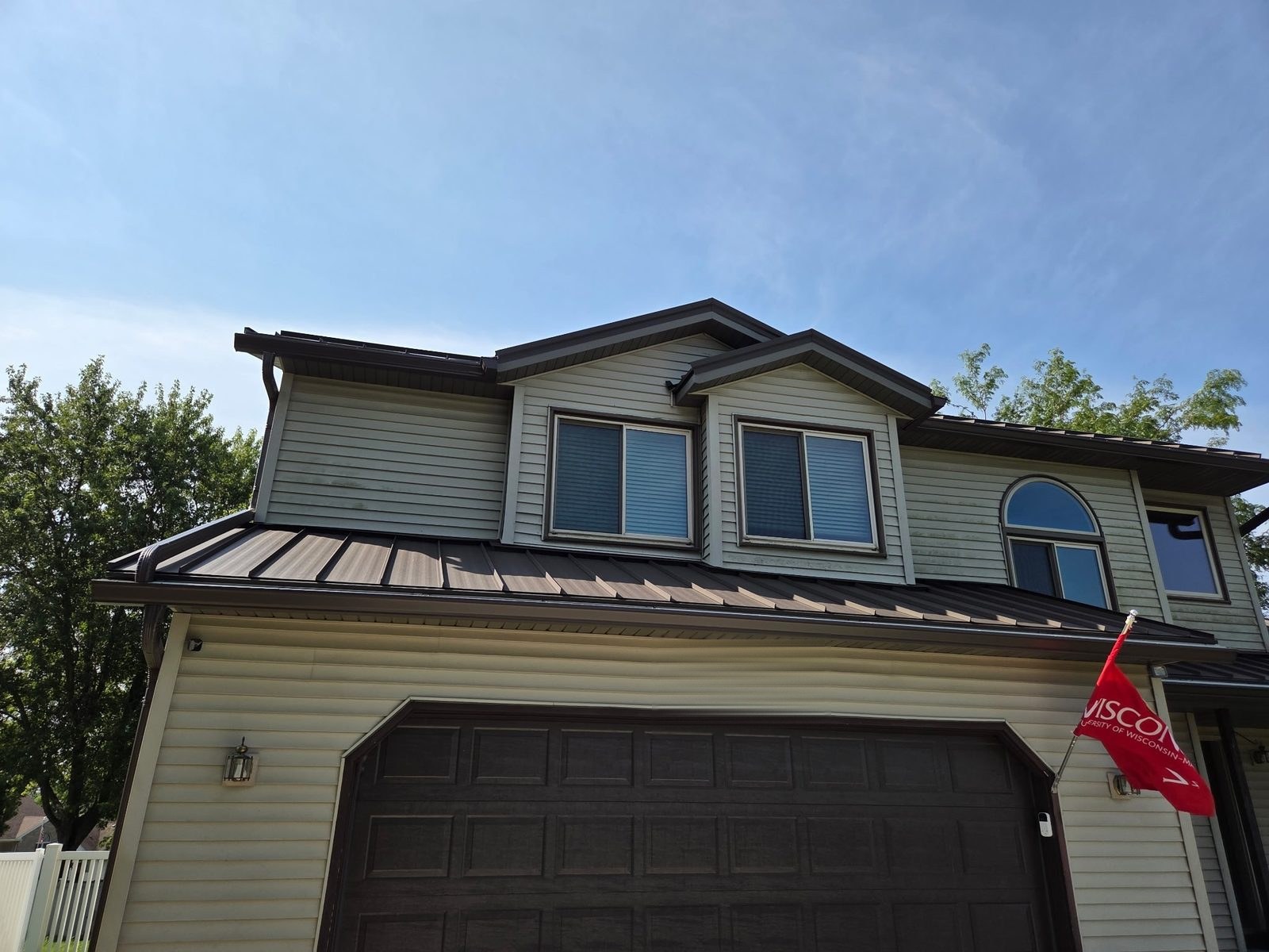New gutters and downspouts, teamed with a buddy’s metal roof
