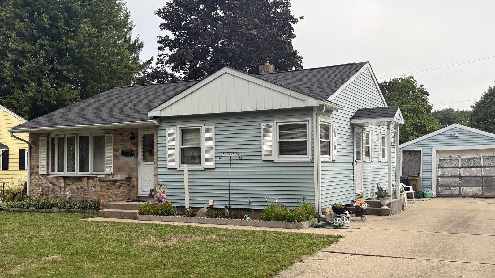 Before: faded pale blue siding